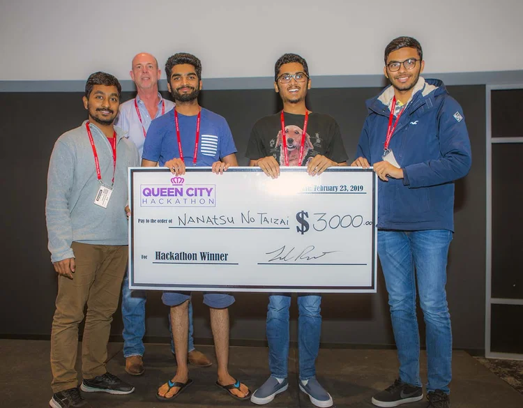 Queen City Hackathon team receiving a $3,000 award in 2019